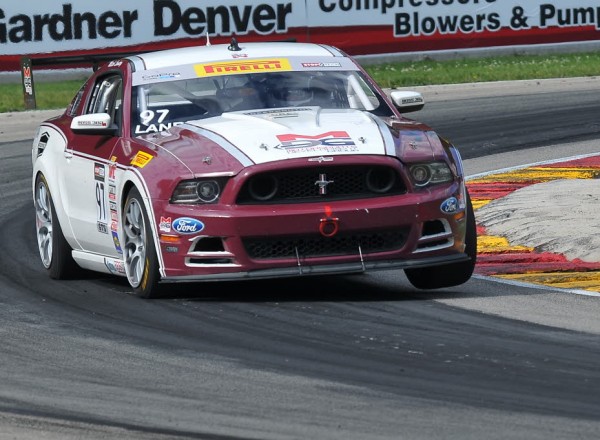 Mitch Landry lifts a wheel with his Ford Mustang Boss 302S  [John Wiedemann Photo]