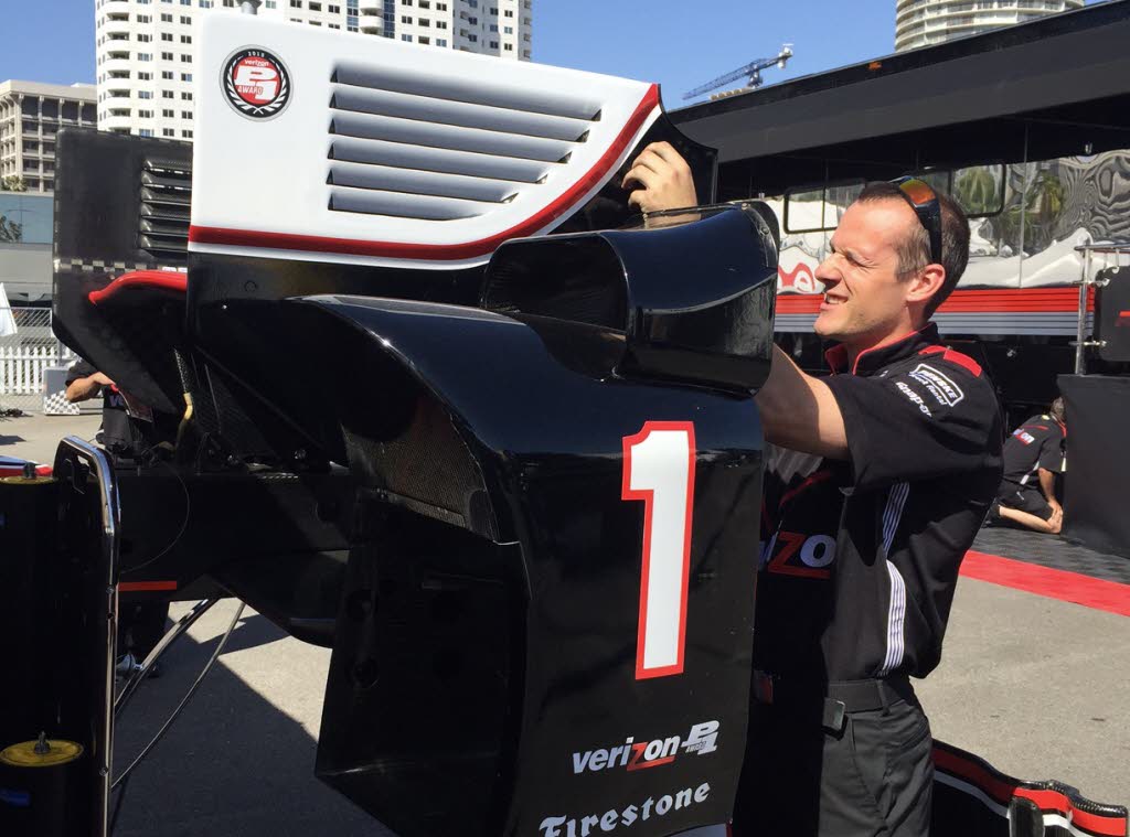 Will Power's mechanic works on a spare rear wing for the Team Penske driver. [Eddie LePine Photo]