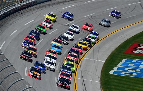 The field races in a tight pack during the NASCAR Sprint Cup Series GEICO 500 at Talladega Superspeedway. [Credit: Jared C. Tilton/Getty Images]