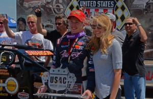 Joined by wife Allison and the winning team, Tanner Swanson enjoys victory lane. [Joe Jennings Photo]