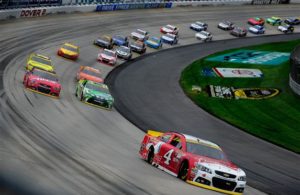 Kevin Harvick leads a pack of cars during the NASCAR Sprint Cup Series AAA 400 at Dover International Speedway. [Credit: Jeff Curry/Getty Images]