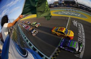 Denny Hamlin and Joey Logano lead the field past the green flag to start the 2015 Ford EcoBoost 400 at Homestead-Miami Speedway. [Credit: Jonathan Ferrey/NASCAR via Getty Images]