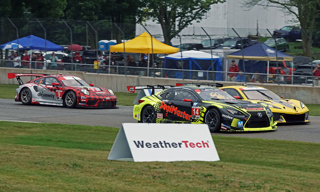 GTDPRO winner VasserSullivan battles with Corvette and the Porsche of Pfaff Motorspots. [Pete Gorski Photo]