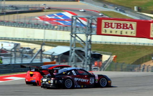 Johnny O’Connell passing Michael Lewis for position.   [Michael Wells Photo]