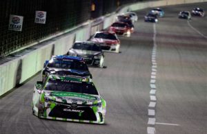 Kyle Busch leads a pack of cars at Texas Motor Speedway in 2016. [Photo by Robert Laberge/NASCAR via Getty Images]