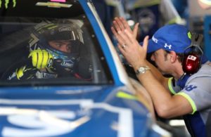 Jimmie Johnson talks with crew chief Chad Knaus during practice for the 59th Annual DAYTONA 500 at Daytona International Speedway. [Credit: NASCAR Via Getty Images]
