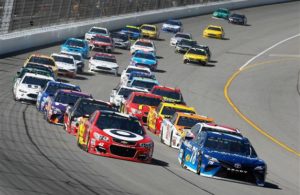 Martin Truex Jr. and Kyle Larson lead a pack of Monster Energy NASCAR Cup Series drivers. [Photo by Brian Lawdermilk/Getty Images]