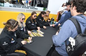 Catepillar drivers signing autographs in pre-race session. [Joe Jennings Photo]