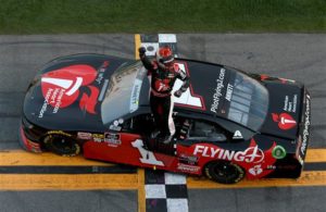 Michael Annett celebrates after winning the NASCAR Xfinity Series NASCAR Racing Experience 300 at Daytona International Speedway. [Sean Gardner/Getty Images]