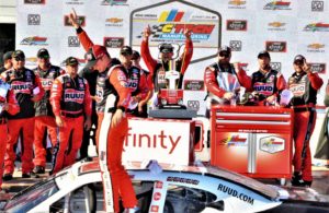 Christopher Bell celebrates with the team in victory lane at Road America. [Dave Jensen Photo]