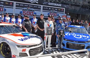 Daytona 500 front-row qualifiers Alex Bowman and Ricky Stenhouse Jr. pose with their crews and Chevrolets. [Joe Jennings Photo]