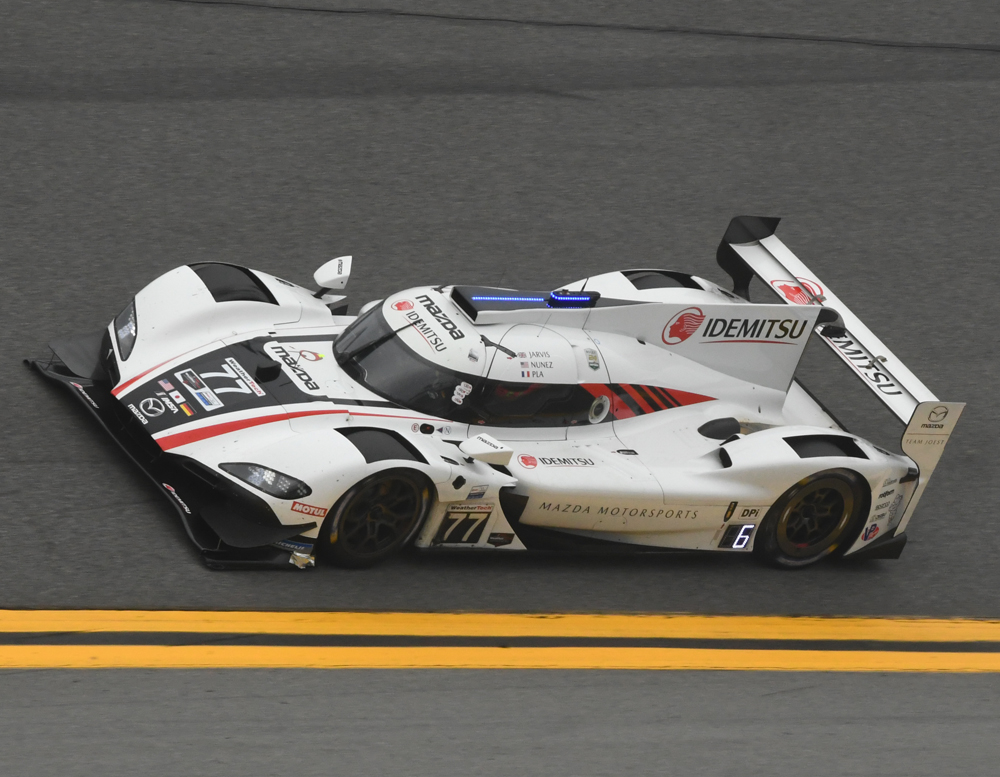 The #77 Pole winning Mazda Team Joest DPi flies through the high banks in Turn 4 at Daytona. [Joe Jennings Photo]