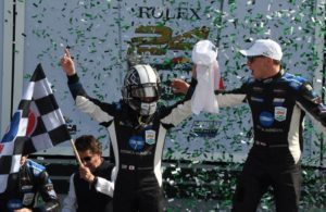 Kamui Kobayashi exits winning car and greeted by co-driver Renger van der Zende and confetti. [Joe Jennings Photo]