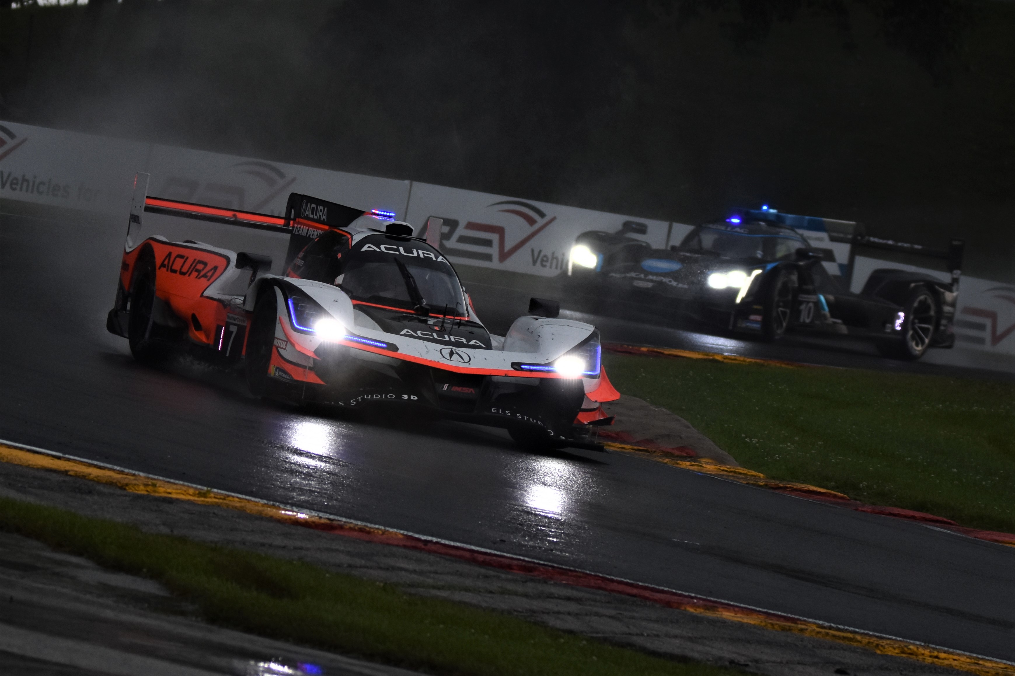 Helio Castroveves drives the Team Penske Acura to the win at Road America ahead of the Wayne Taylor Racing Cadillac DPi. [John Wiedemann Photo]