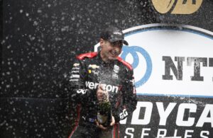 Will Power celebrates after winning the 2021 Big Machine Spiked Coolers Grand Prix at Indianapolis Motor Speedway Road Course. [Media Credit: Penske Entertainment: Chris Jones]