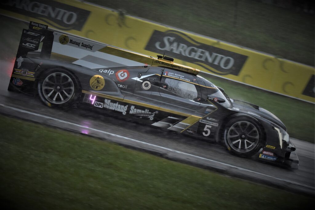 Racing in the rain to Turn 7 at Road America. [John Wiedemann Photo]