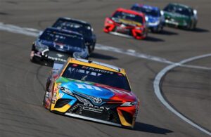 Kyle Busch leads a pack of cars during the NASCAR Cup Series South Point 400 at Las Vegas Motor Speedway. [Credit: Brian Lawdermilk/Getty Images]