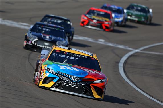 Kyle Busch leads a pack of cars during the NASCAR Cup Series South Point 400 at Las Vegas Motor Speedway. [Credit: Brian Lawdermilk/Getty Images]