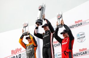 The podium for the Hy-VeeDeals.com 250 presented by DoorDash: Pato O'Ward (2nd), Josef Newgarden (winner) and Will Power (3rd). [Media Credit-Penske Entertainment: Joe Skibinski]