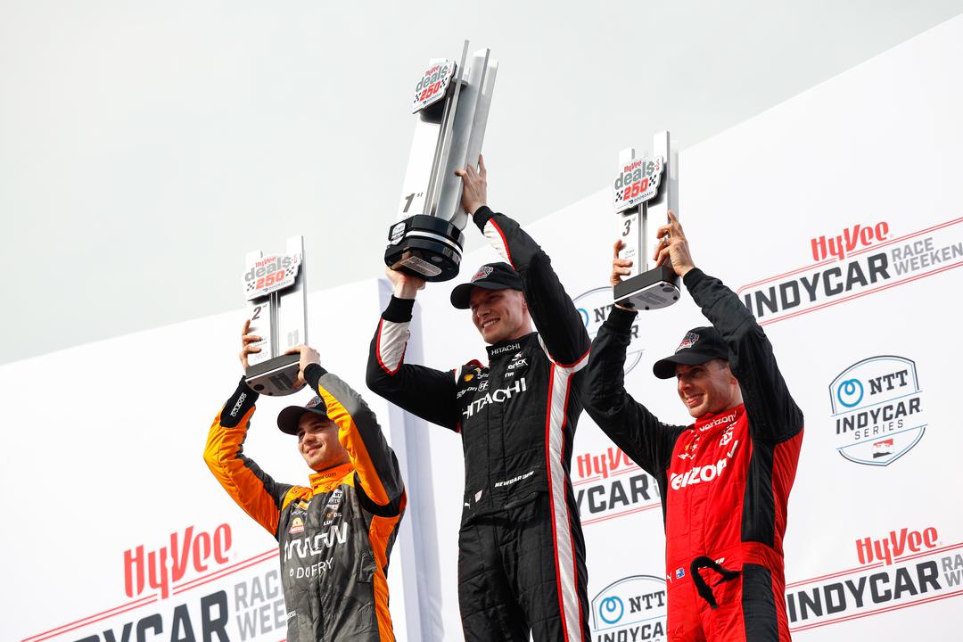 The podium for the Hy-VeeDeals.com 250 presented by DoorDash: Pato O'Ward (2nd), Josef Newgarden (winner) and Will Power (3rd). [Media Credit-Penske Entertainment: Joe Skibinski]