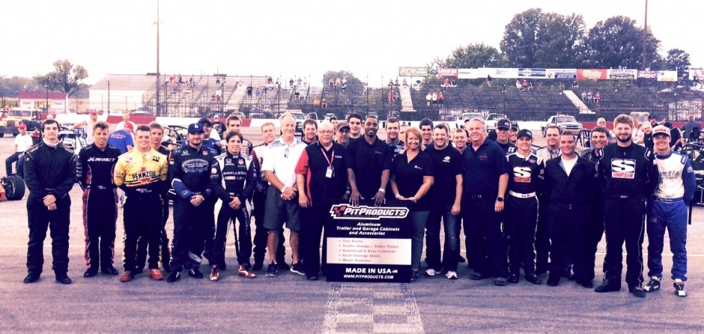 Tony Stewart and promoter, Larry Curry poses with the starting field of the first annual Tony Stewart Classic Saturday evening.   [Photo by Steve Zautke]